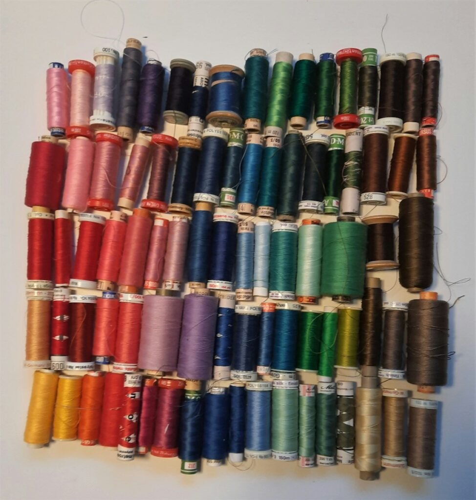 green blue and red thread rolls